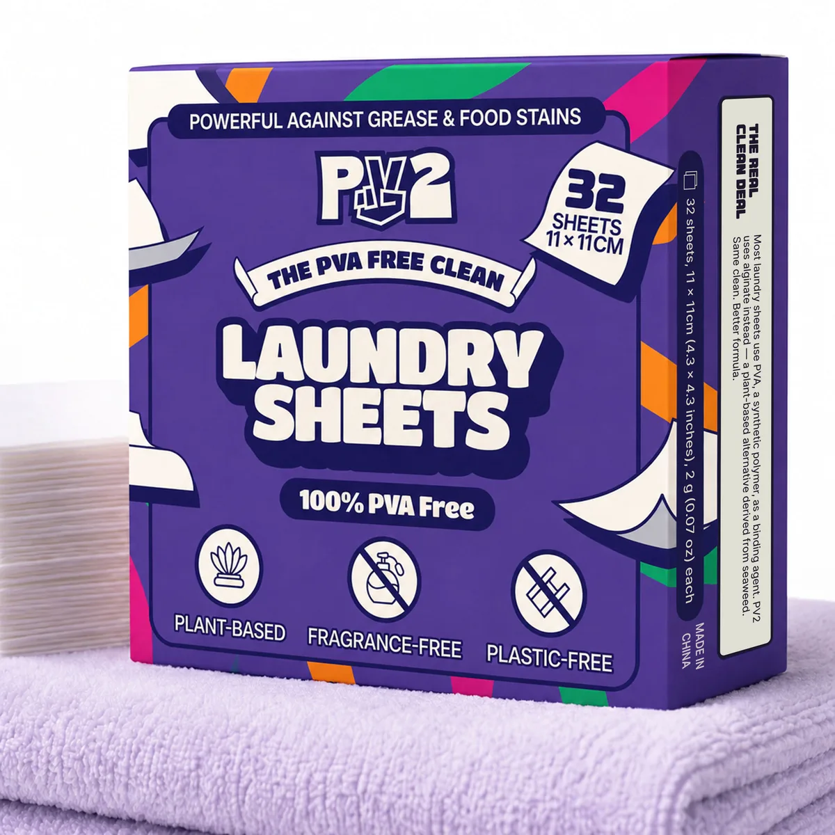 PV2 laundry sheets box resting on folded towels beside a stack of sheets